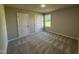 Inviting bedroom with natural light, two closets, and soft carpeting at 154 Oakfield Trace Dr, Four Oaks, NC 27524