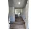 Inviting entryway with sleek wood flooring that leads into a spacious living area with neutral walls at 154 Oakfield Trace Dr, Four Oaks, NC 27524