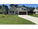Charming single-Gathering home featuring a two-car garage, well-manicured lawn, and neutral color palette at 154 Oakfield Trace Dr, Four Oaks, NC 27524