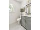 Bathroom featuring vanity with marble countertop, gray cabinets and hexagonal tile flooring at 16 Cedar Hill Dr, Durham, NC 27713