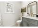 Well-lit bathroom with stylish vanity, marble countertop, and modern fixtures at 16 Cedar Hill Dr, Durham, NC 27713