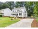 Charming two-story home with a covered front porch and well-maintained landscaping at 16 Cedar Hill Dr, Durham, NC 27713