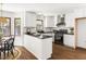 Modern kitchen with white cabinets, black countertops, and stainless steel appliances at 16 Cedar Hill Dr, Durham, NC 27713
