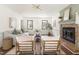 Inviting living room featuring a fireplace, neutral furniture, and plenty of natural light at 16 Cedar Hill Dr, Durham, NC 27713