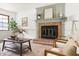 Cozy living room featuring a fireplace with tile surround and a stylish coffee table at 16 Cedar Hill Dr, Durham, NC 27713