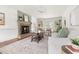 Bright living room with fireplace, built-in shelves, and French doors to the outside at 16 Cedar Hill Dr, Durham, NC 27713