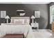 Comfortable main bedroom with neutral walls, soft rug, sitting bench, and great natural lighting at 16 Cedar Hill Dr, Durham, NC 27713