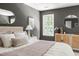 Well-lit main bedroom with large window, stylish furnishings, and a view to the outdoors at 16 Cedar Hill Dr, Durham, NC 27713