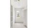Bright, well-lit walk-in closet with shelving, hanging rods, and window to outdoors at 16 Cedar Hill Dr, Durham, NC 27713