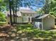 Large backyard featuring an outbuilding and mature trees at 18 Clover Hil Pl, Durham, NC 27712