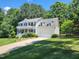 A lovely home with an attached two-car garage and pristine landscaping at 18 Clover Hil Pl, Durham, NC 27712