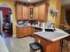 Eat-in kitchen featuring wood cabinets, counter tops, and modern appliances at 18 Clover Hil Pl, Durham, NC 27712
