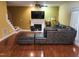 Inviting living room with fireplace, hardwood floors, and access to an outdoor patio at 18 Clover Hil Pl, Durham, NC 27712