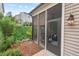 Screened porch exterior with patio, landscaping, and residential view at 1924 Rustica Dr, Durham, NC 27713
