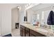 Bathroom featuring double sink vanity with granite countertops and tile flooring at 1924 Rustica Dr, Durham, NC 27713