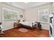 Sunlit bedroom with hardwood floors and comfortable furnishings; cozy and inviting at 1924 Rustica Dr, Durham, NC 27713