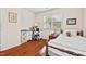 Charming bedroom with hardwood floors, natural light, and a cozy reading nook at 1924 Rustica Dr, Durham, NC 27713