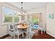 Bright dining area with banquette seating and sliding doors to outdoor space at 1924 Rustica Dr, Durham, NC 27713