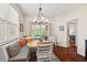 Cozy dining area with banquette seating and natural light; bedroom access at 1924 Rustica Dr, Durham, NC 27713