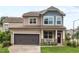 Charming two-story home with a well-manicured lawn and a two-car garage in a lovely neighborhood at 1924 Rustica Dr, Durham, NC 27713