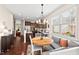 Cozy kitchen nook with banquette seating, pendant lighting, and access to kitchen at 1924 Rustica Dr, Durham, NC 27713