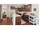Contemporary kitchen with dark cabinetry, granite countertops, and stainless steel appliances at 1924 Rustica Dr, Durham, NC 27713