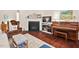 Bright living room with hardwood floors, fireplace, and comfortable furnishings for relaxation at 1924 Rustica Dr, Durham, NC 27713