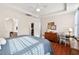 Bright main bedroom with ceiling fan, ensuite, and a desk area; offers comfortable living at 1924 Rustica Dr, Durham, NC 27713