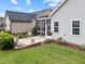 View of the backyard and screened-in porch on a home with gray siding at 20 Sweet Birch Row, Youngsville, NC 27596