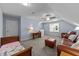 Expansive bonus room with carpet, and an inviting living area with furniture and lots of natural light at 20 Sweet Birch Row, Youngsville, NC 27596