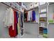Walk-in closet with shelves and organized clothes at 20 Sweet Birch Row, Youngsville, NC 27596