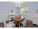 Bright dining room with refined lighting and wainscoting, offering a blend of comfort and elegance at 20 Sweet Birch Row, Youngsville, NC 27596