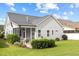 Exterior side angle of a home, showing the yard, patio, and screened-in porch at 20 Sweet Birch Row, Youngsville, NC 27596