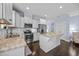Well-equipped kitchen with stainless appliances, granite counters, and a functional island for food prep and serving at 20 Sweet Birch Row, Youngsville, NC 27596