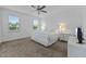 Bright, well-lit bedroom with two windows and neutral carpet at 20 Sweet Birch Row, Youngsville, NC 27596