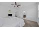Bedroom with a view to the bathroom with dual sinks, and carpeted floor at 20 Sweet Birch Row, Youngsville, NC 27596