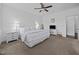 White bedroom with large bed, ceiling fan, and carpeted floor at 20 Sweet Birch Row, Youngsville, NC 27596