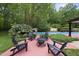 Enjoy a fire in the backyard of this home surrounded by mature landscaping at 213 Chimeneas Pl, Chapel Hill, NC 27517
