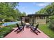 Enjoy a fire in the backyard of this home surrounded by mature landscaping at 213 Chimeneas Pl, Chapel Hill, NC 27517
