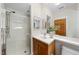 Bright bathroom with glass shower, modern vanity, and framed mirror, offering a clean and contemporary space at 213 Chimeneas Pl, Chapel Hill, NC 27517