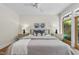 Bedroom featuring a ceiling fan, rug, and natural light at 213 Chimeneas Pl, Chapel Hill, NC 27517