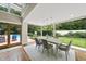 Bright dining room with tile floors, big windows and backyard view at 213 Chimeneas Pl, Chapel Hill, NC 27517