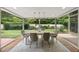 Bright dining room features backyard views, neutral colors and modern lighting at 213 Chimeneas Pl, Chapel Hill, NC 27517