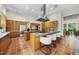 Modern kitchen with tile floors, bar seating and stainless steel appliances at 213 Chimeneas Pl, Chapel Hill, NC 27517