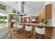 Open-concept kitchen with granite countertops and stainless appliances at 213 Chimeneas Pl, Chapel Hill, NC 27517