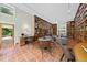 Elegant library with tile flooring, built-in shelving, and a sunlit view at 213 Chimeneas Pl, Chapel Hill, NC 27517