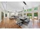Open concept floor plan of the living room, dining room, and many windows providing plenty of natural light at 213 Chimeneas Pl, Chapel Hill, NC 27517