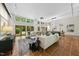 Spacious living room with neutral couches, lots of windows with lovely views, and tile flooring at 213 Chimeneas Pl, Chapel Hill, NC 27517