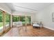 Living space with terracotta tile flooring and multiple glass doors for ample natural light at 213 Chimeneas Pl, Chapel Hill, NC 27517
