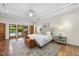 Inviting main bedroom with access to backyard, and stylish furnishings at 213 Chimeneas Pl, Chapel Hill, NC 27517